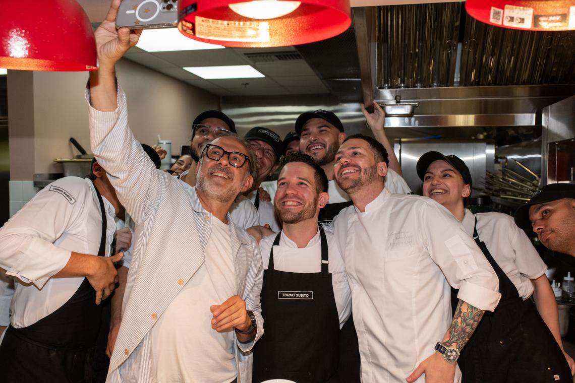 Chef Massimo Bottura takes a selfie with the team at his new Italian restaurant Torno Subito in Miami.