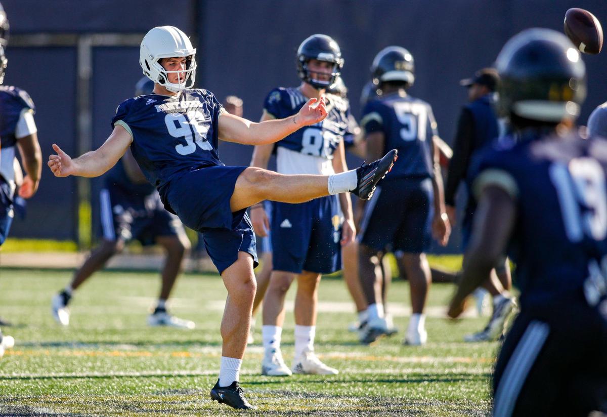 FIU punter Jordan Doelling (96) kicks the football during practice at Florida International University in Miami, Florida, on Tuesday, August 16, 2022.
