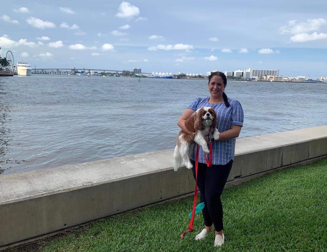 Brickell Key resident Priscilla Colon with her dog, Astro, who became severely ill after an anti-coronavirus disinfectant was sprayed daily around the island. Astro’s vet is concerned about damage to his throat and stomach caused by ingesting chemicals in the cleanser.