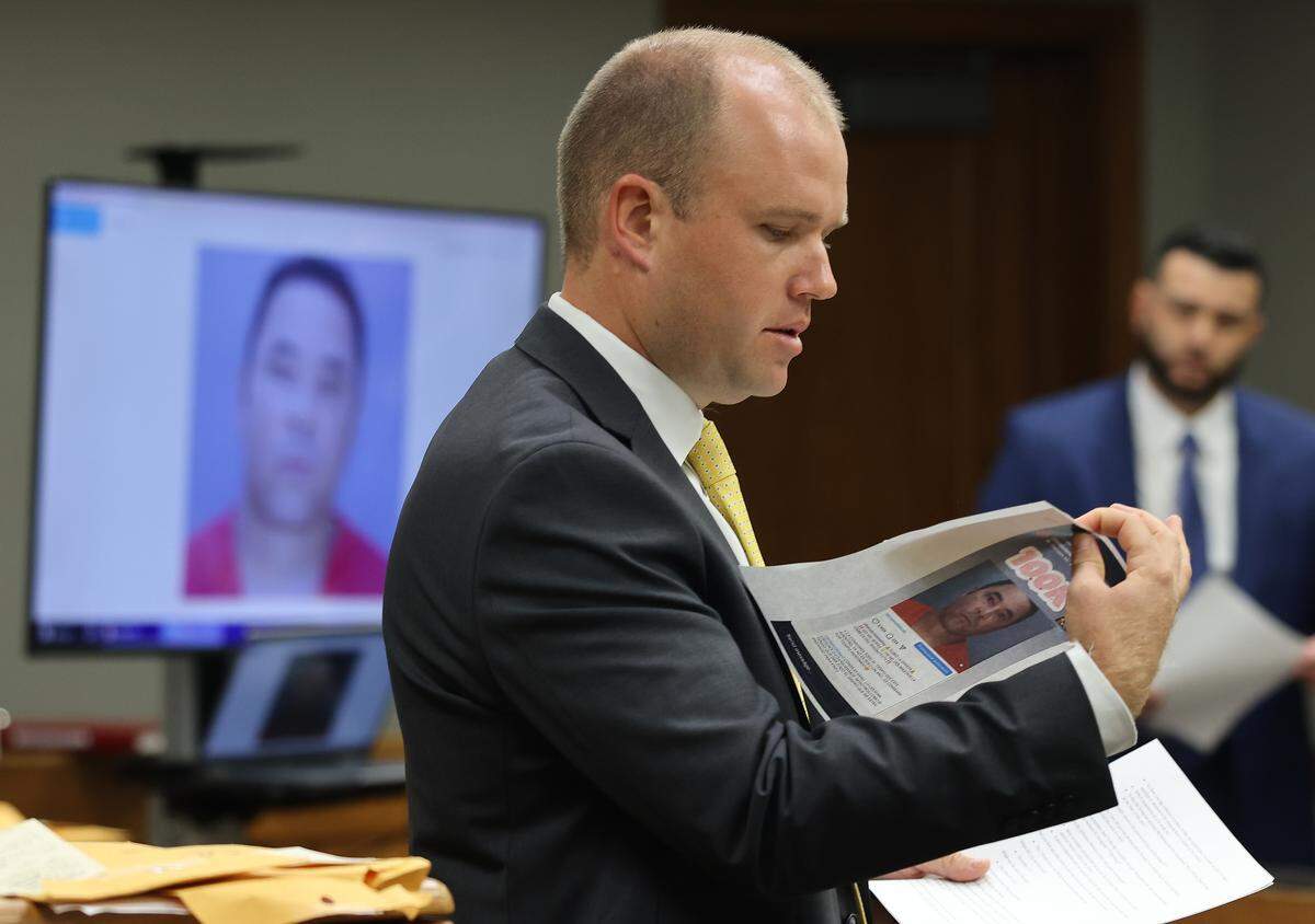 Prosecutor George Bell submits evidence as the State’s witness testifies on the first day of solicitation of first-degree murder trial of Cuban rapper Yosvanis “Chocolate MC” Sierra Hernandez in Courtroom 7-4 at the Richard E. Gerstein Justice Building on Wednesday, November 12, 2025, in Miami, Florida. 
