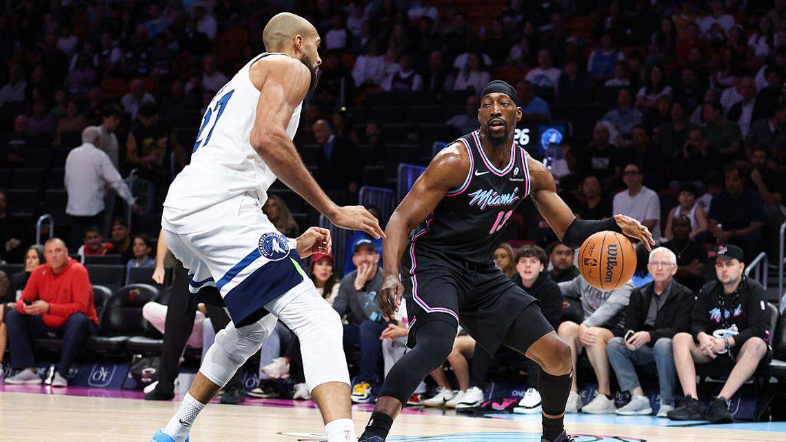Bam Adebayo #13 of the Miami Heat dribbles the ball against Rudy Gobert #27 of the Minnesota Timberwolves during the first quarter of the game at Kaseya Center on January 03, 2026 in Miami.
