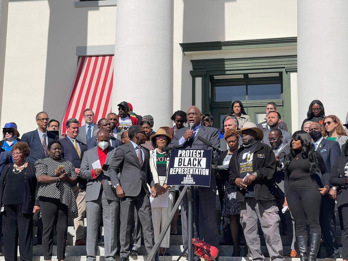 Pastor RB Holmes, with Bethel Missionary Baptist, organizers and Black Florida lawmakers gather to speak against a congressional map proposed by Gov. Ron DeSantis.