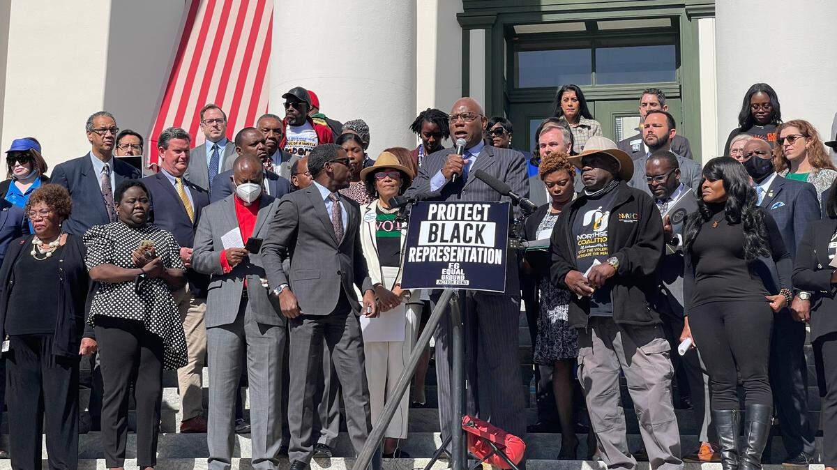Pastor RB Holmes, with Bethel Missionary Baptist, organizers and Black Florida lawmakers gather to speak against a congressional map proposed by Gov. Ron DeSantis.