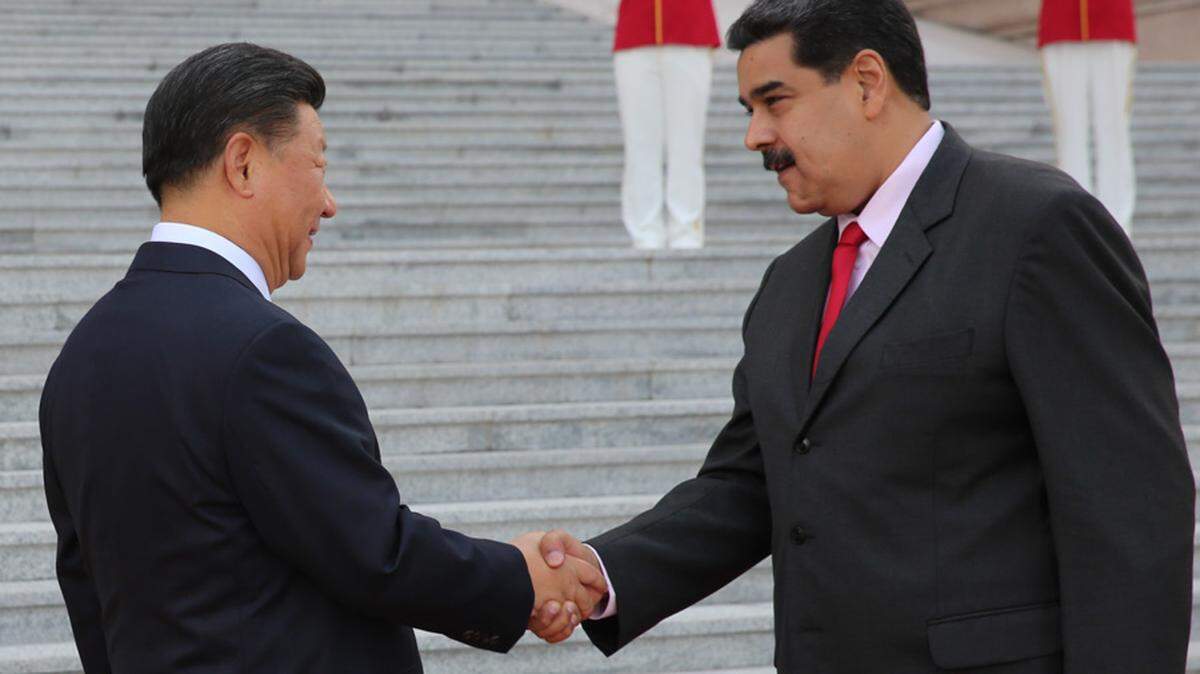 Venezuelan President Nicolás Maduro, right, greets Chinese President Xi Jinping on Friday, Sept. 14, 2018, in Beijing. The South American nation is hopng to secure a $5 billion loan amid its economic crisis.
