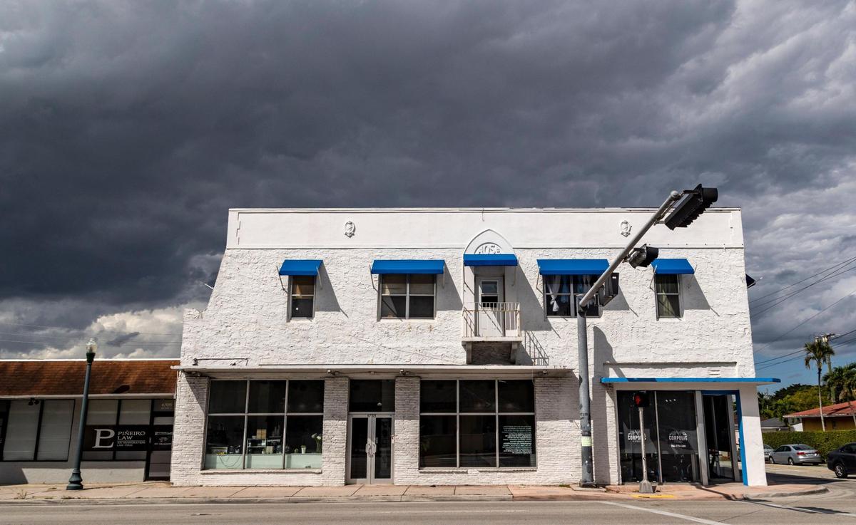 White Rose Coffee Shop, at 4703 SW Eighth St., sits across from a by-the-hour Coral Gables motel.