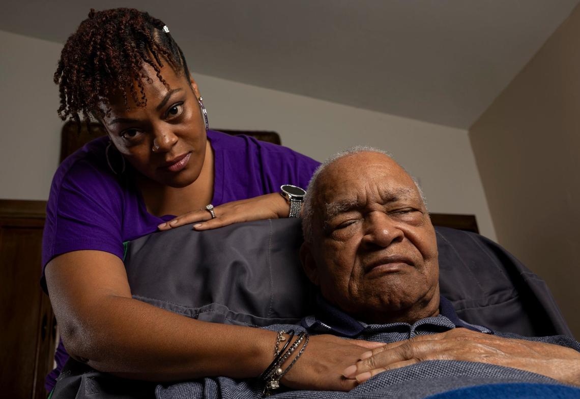 Krystal Adderley, 40, embraces her father, David Lawrence Adderley, 86, at their home in Miami-Dade on Thursday, Aug. 29, 2024.