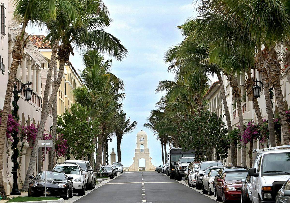 In 2010, a view of Worth Avenue with clock tower in the background and some of the 200 coconut palms that line the street after the completion of renovations in Palm Beach.