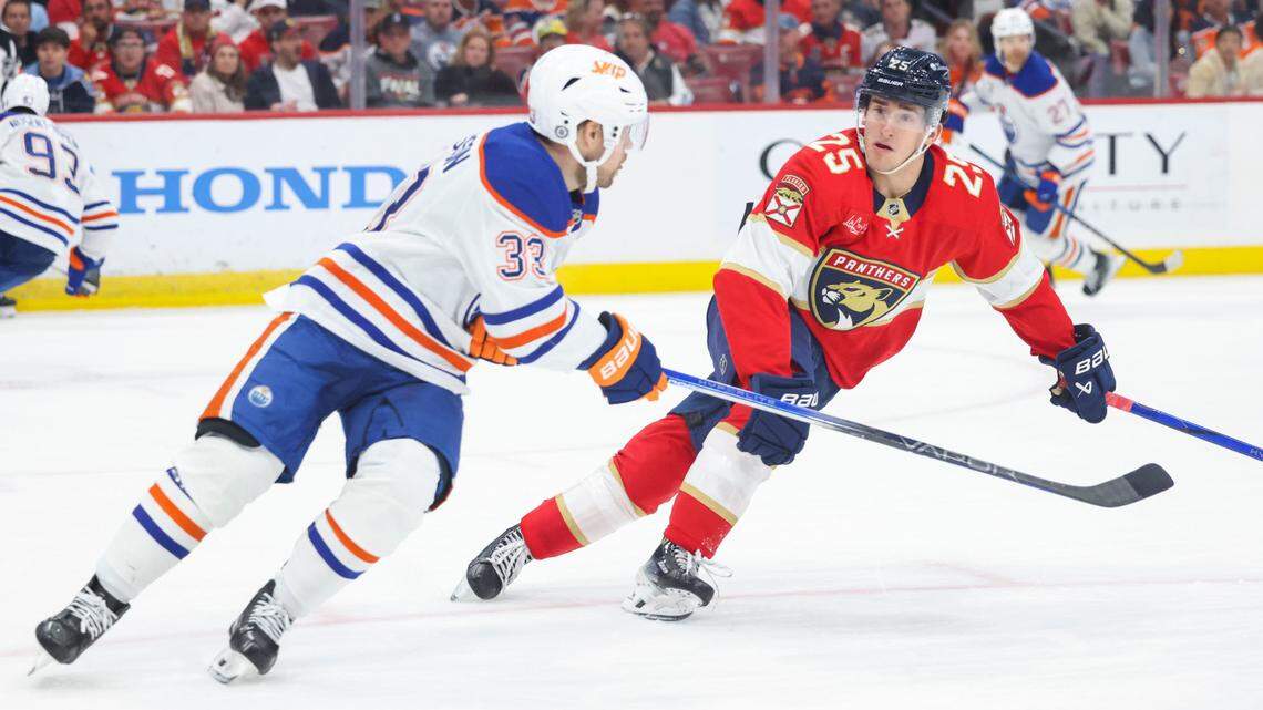 Florida Panthers right wing Mackie Samoskevich (25) defends Edmonton Oilers left wing Viktor Arvidsson (33) during the third period of a game on Thursday, Feb. 27, 2025, at Amerant Bank Arena in Sunrise, Fla. The Panthers won 4-3.