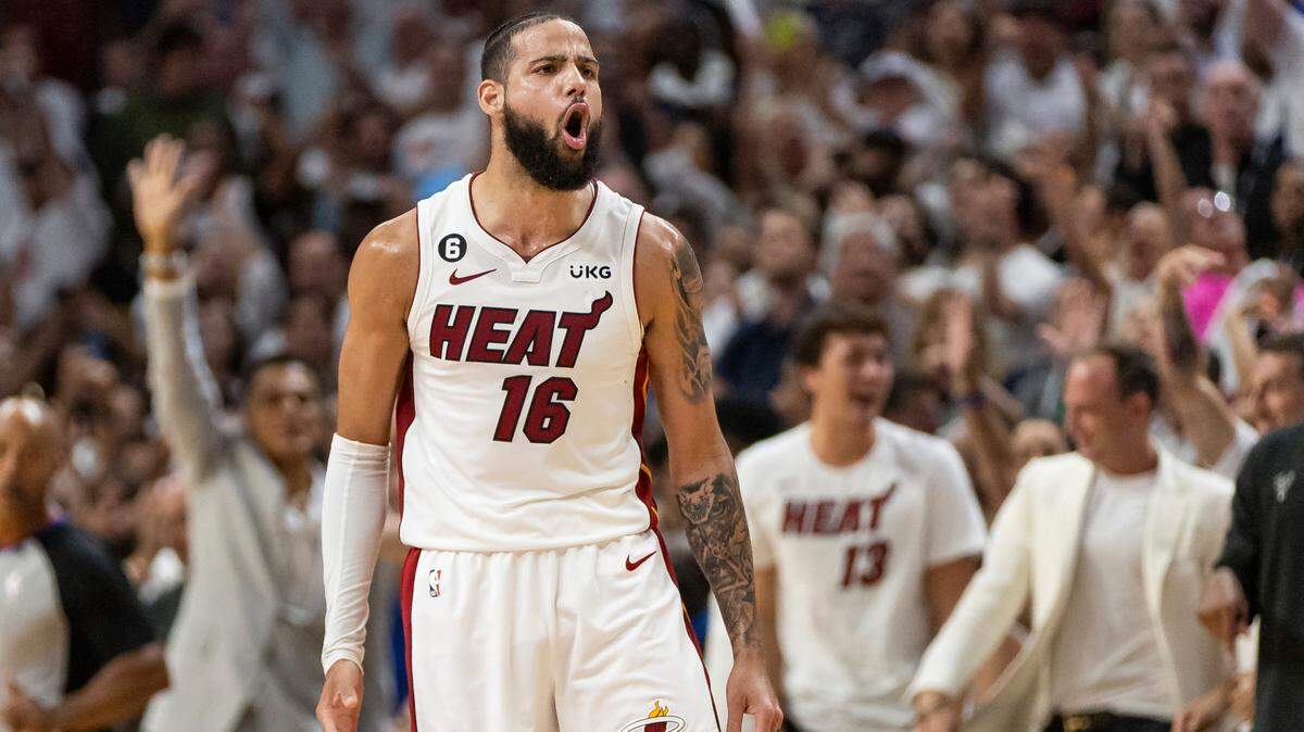 Miami Heat forward Caleb Martin (16) reacts after scoring against the Milwaukee Bucks during the fourth quarter of Game 4 in the first-round NBA basketball playoff series at Kaseya Center on Monday, April 24, 2023, in downtown Miami.