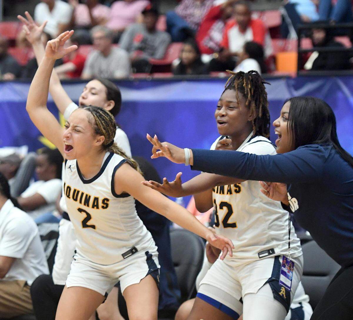 Players on the St. Thomas Aquinas bench celebrate a three pointer in the closing seconds of the game against Bloomingdale in the Class 6A final during the Florida High School State Championships at the RP Funding Center in Lakeland, Fl on Friday March 8, 2024. St. Thomas defeated Bloomingdale 70-35. Scott Wheeler | Photo