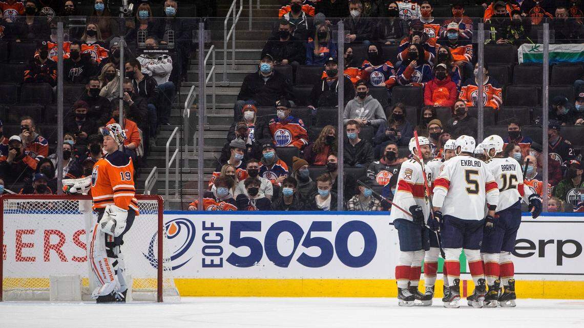 Florida Panthers players celebrate a goal on Edmonton Oilers goalie Mikko Koskinen (19), left, during the second period of an NHL hockey game Thursday, Jan. 20, 2022, in Edmonton, Alberta. Panthers forward Sam Reinhart had the primary assist on both of the Panthers’ second-period goals.