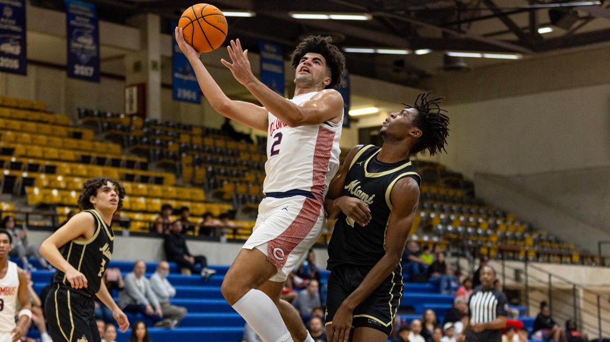 Columbus forward Cayden Boozer (2) lays up the ball while defended by Miami High forward Eddy Bonilla (30) during the first half of the GMAC Basketball Finals at Miami-Dade Kendall campus gym in Miami, Florida on Saturday, January 27, 2024.