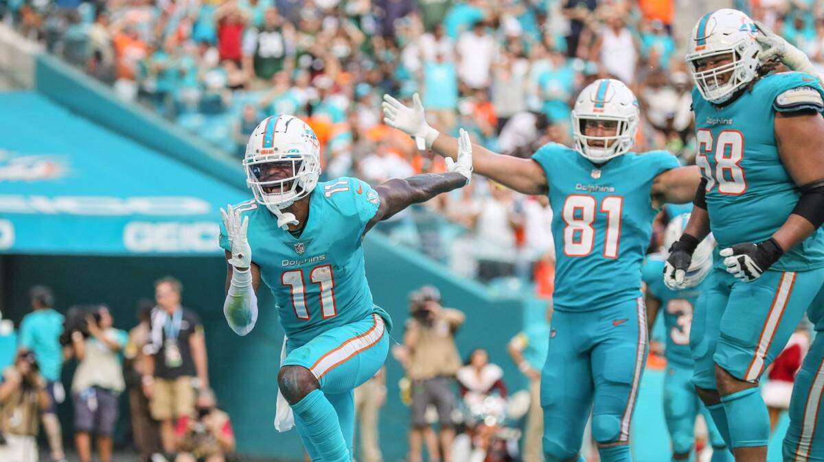 Miami Dolphins wide receiver DeVante Parker (11) reacts after scoring in the the fourth quarter on a reception from quarterback Tua Tagovailoa (1) against the New York Jets at Hard Rock Stadium in Miami Gardens on Sunday, December 19, 2021.