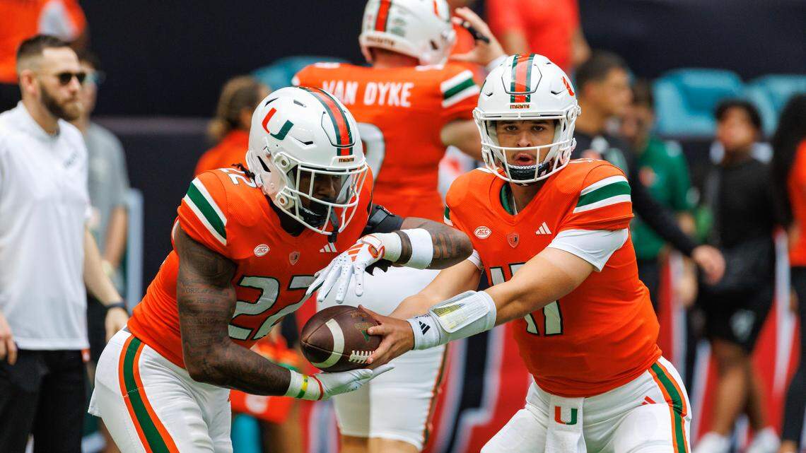 Miami Hurricanes quarterback Emory Williams (17) hand off to Hurricanes running back Mark Fletcher Jr. (22) before the start of the their NCAA non conference game against Texas A&M at Hard Rock Stadium on Saturday, Sept. 9, 2023 in Miami Gardens, Florida.