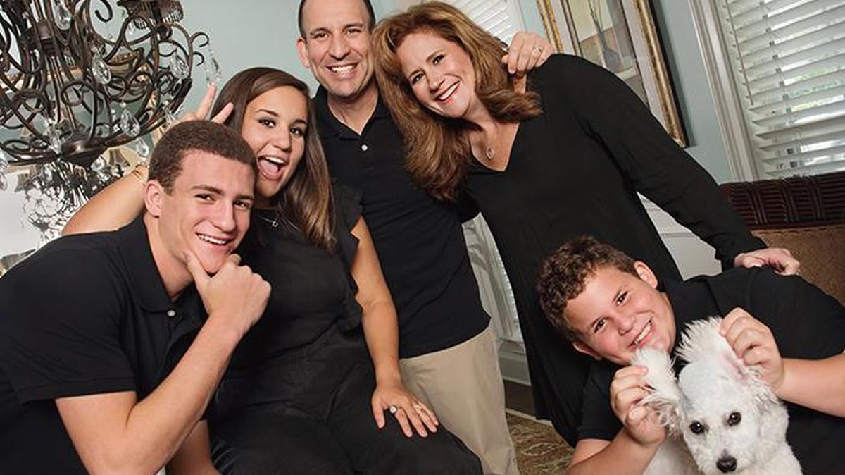 Jason Mendelsohn, standing in back, with his family, from left to right: Ryan, Lauren, his wife Ronni, Adam and Dez, the dog. Mendelsohn was diagnosed with stage 4 human papillomavirus-related throat cancer. He believes he contracted HPV some 25 years earlier from oral sex in college.