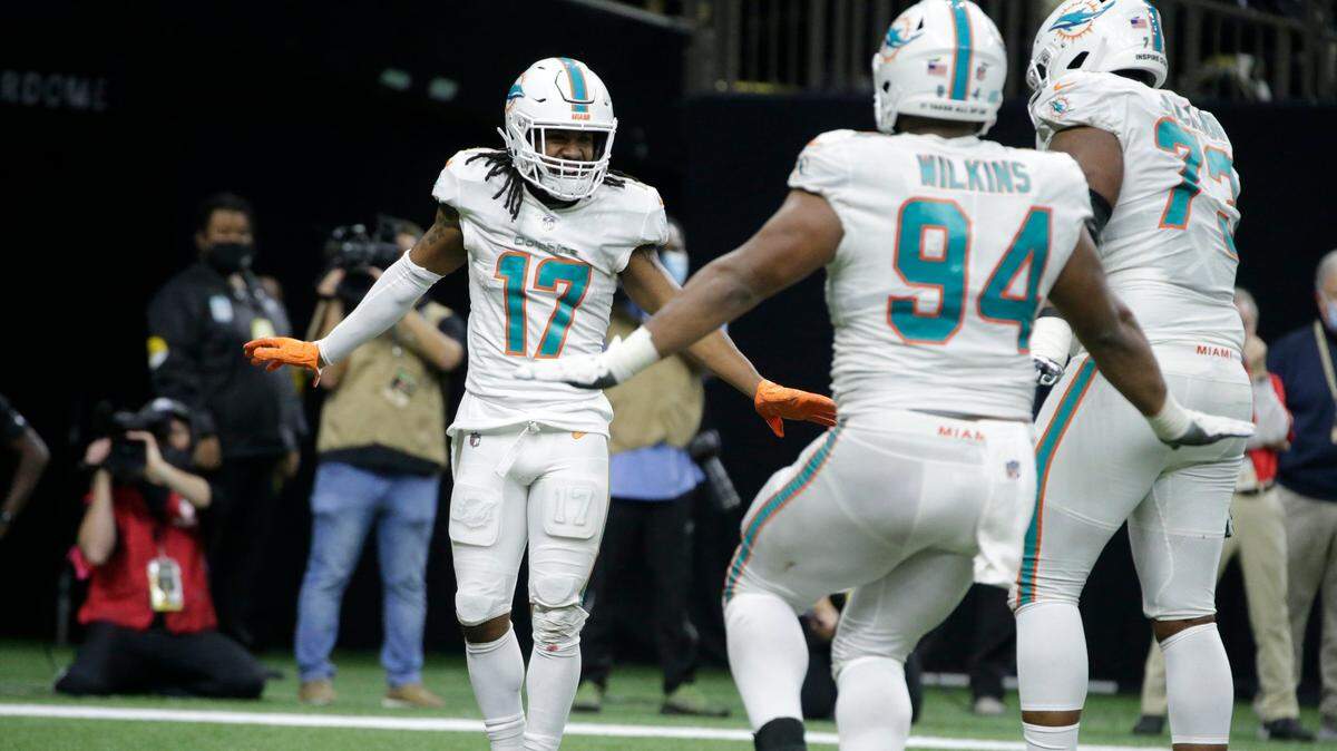 Miami Dolphins’ Jaylen Waddle (17) celebrates with teammates after scoring a touchdown against the New Orleans Saints during the second half of an NFL football game Monday, Dec. 27, 2021, in New Orleans. (AP Photo/Butch Dill)