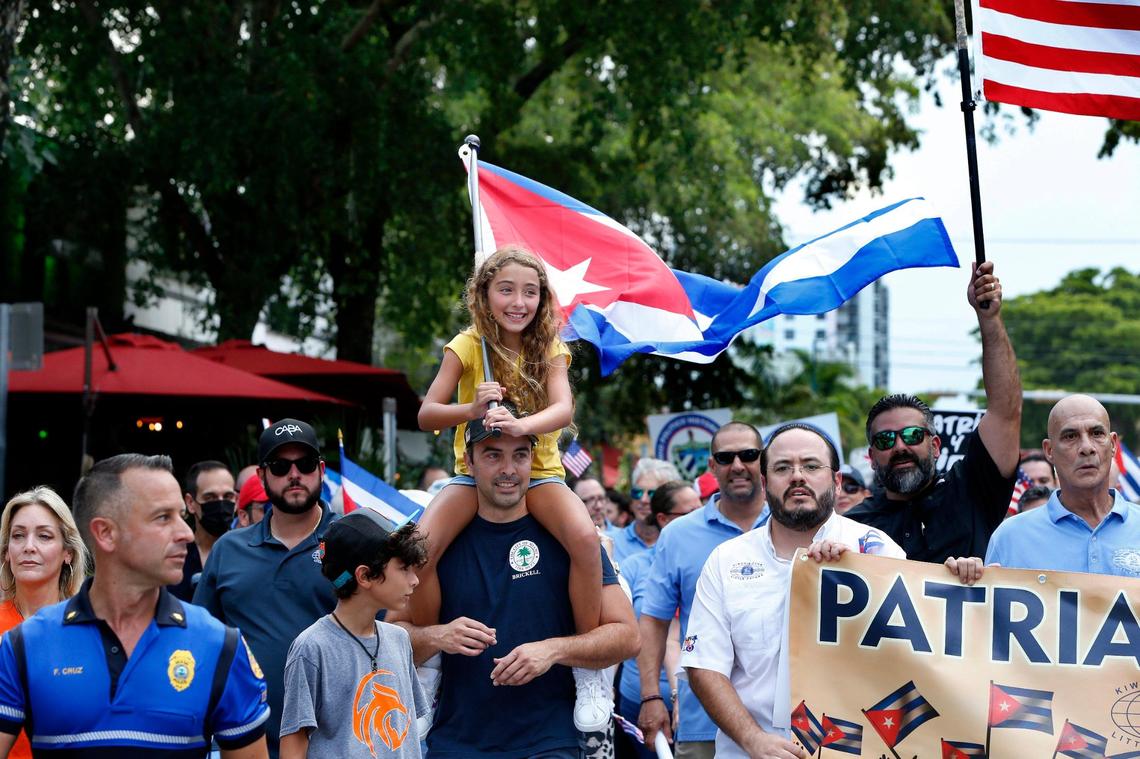 Mia Chacon and father Omar Chacon joined a group of Cuban exiles on a march by the Kiwanis Club of Little Havana along Southwest Eighth Street to the Bay of Pigs Heroes Monument on Friday, July 23, 2021, to show solidarity and support for the Cuban people asking for freedom on the island.