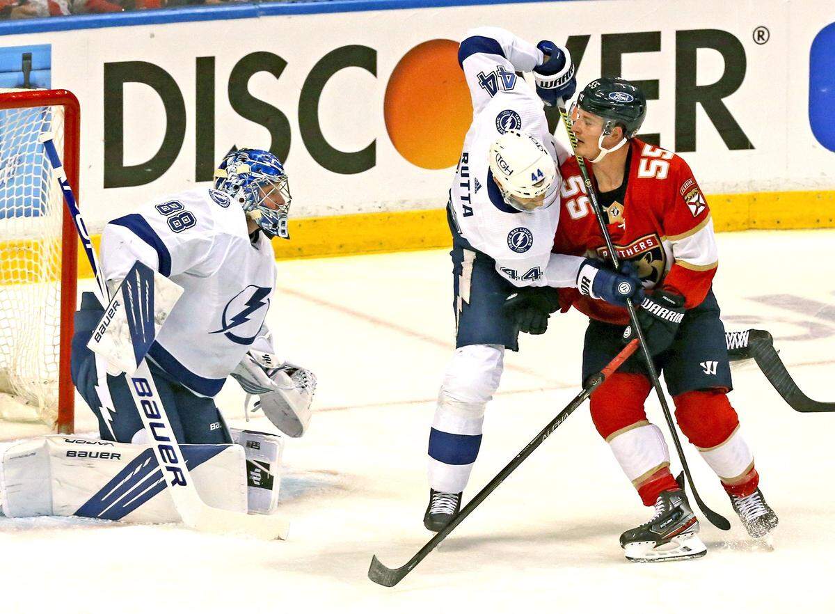 Florida Panthers Noel Acciari (55) and Tampa Bay Lighting Jan Rutta (44) collide during the first period of game 2 of their first round NHL Stanley Cup playoff series at the BB&T Center on Tuesday, May 18, 2021 in Sunrise, Florida.