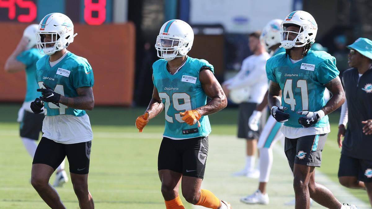 Miami Dolphins cornerback Torry McTyer (24), runs alongside Minkah Fitzpatrick (29) and Jonathan Alson (41) during Friday’s practice. McTyer received first-team cornerback snaps on Saturday.