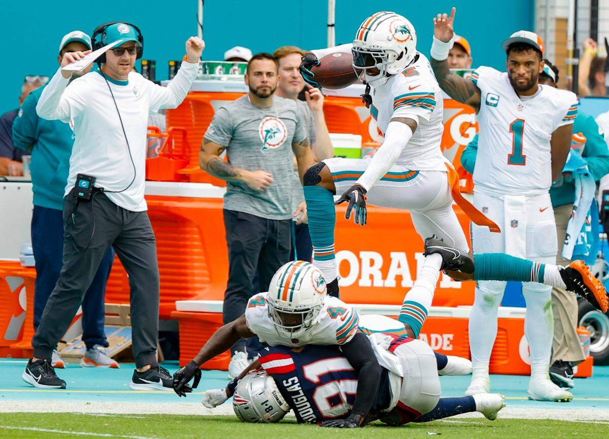 Miami Dolphins cornerback Jalen Ramsey (5) intercepts a pass during the game against the New England Patriots in the second quarter at Hard Rock Stadium in Miami Gardens on Sunday, October 29, 2023.