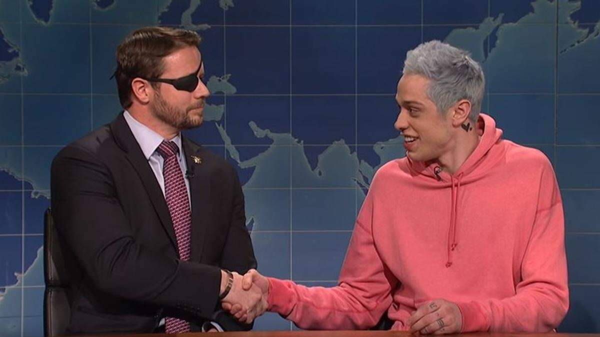 Comedian Pete Davidson, right, shakes hands with Dan Crenshaw, a former Navy SEAL and Texas Republican newly elected to Congress.