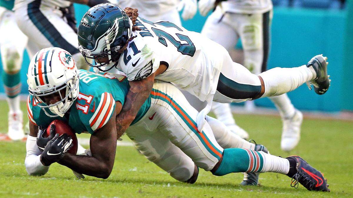 Miami Dolphins wide receiver DeVante Parker (11) catches a pass as Philadelphia Eagles Ronald (21) defends in the second quarter at Hard Rock Stadium in Miami Gardens, Florida, Sunday, December, 1, 2019.