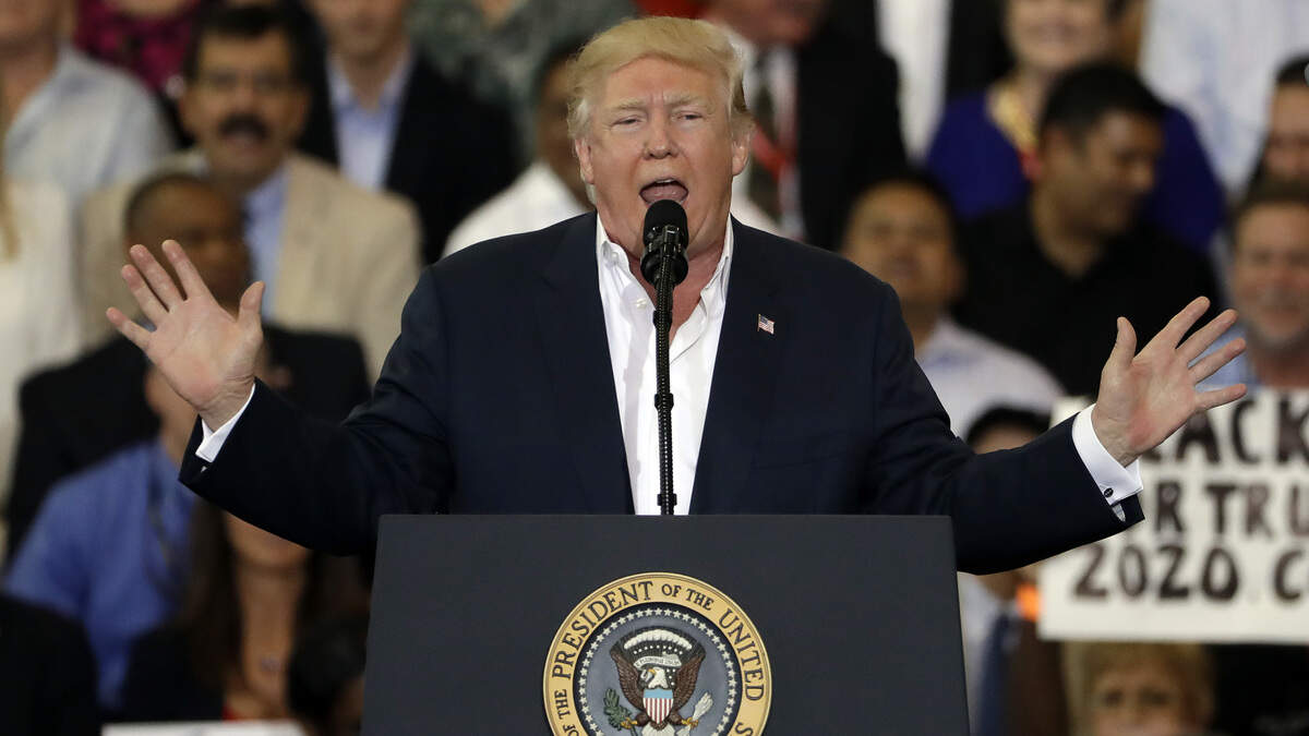 President Donald Trump gestures during a “Make America Great Again Rally” at Orlando-Melbourne International Airport Saturday, Feb. 18, 2017, in Melbourne.