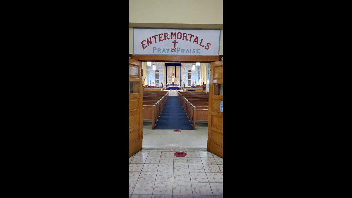 A welcoming sign at the historic Saint Agnes Episcopal Church in Overtown.