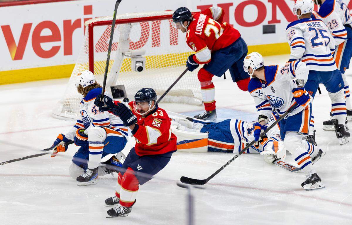 Florida Panthers center Brad Marchand (63) reacts after scoring a goal against the Edmonton Oilers during the first period of Game 3 in the NHL Stanley Cup Final series at Amerant Bank Arena on Monday, June 9, 2025, in Sunrise, Fla.