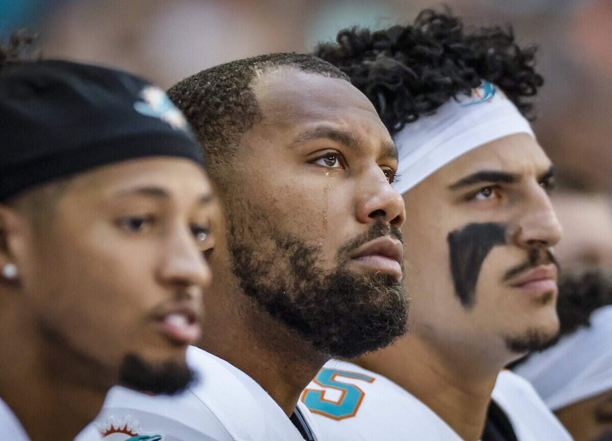 Miami Dolphins linebacker Bradley Chubb (2) tears during the national anthem before an NFL game against the Indianapolis Colts at Lucas Oil Stadium on Sunday, Sept. 7, 2025, Indianapolis, Indiana.