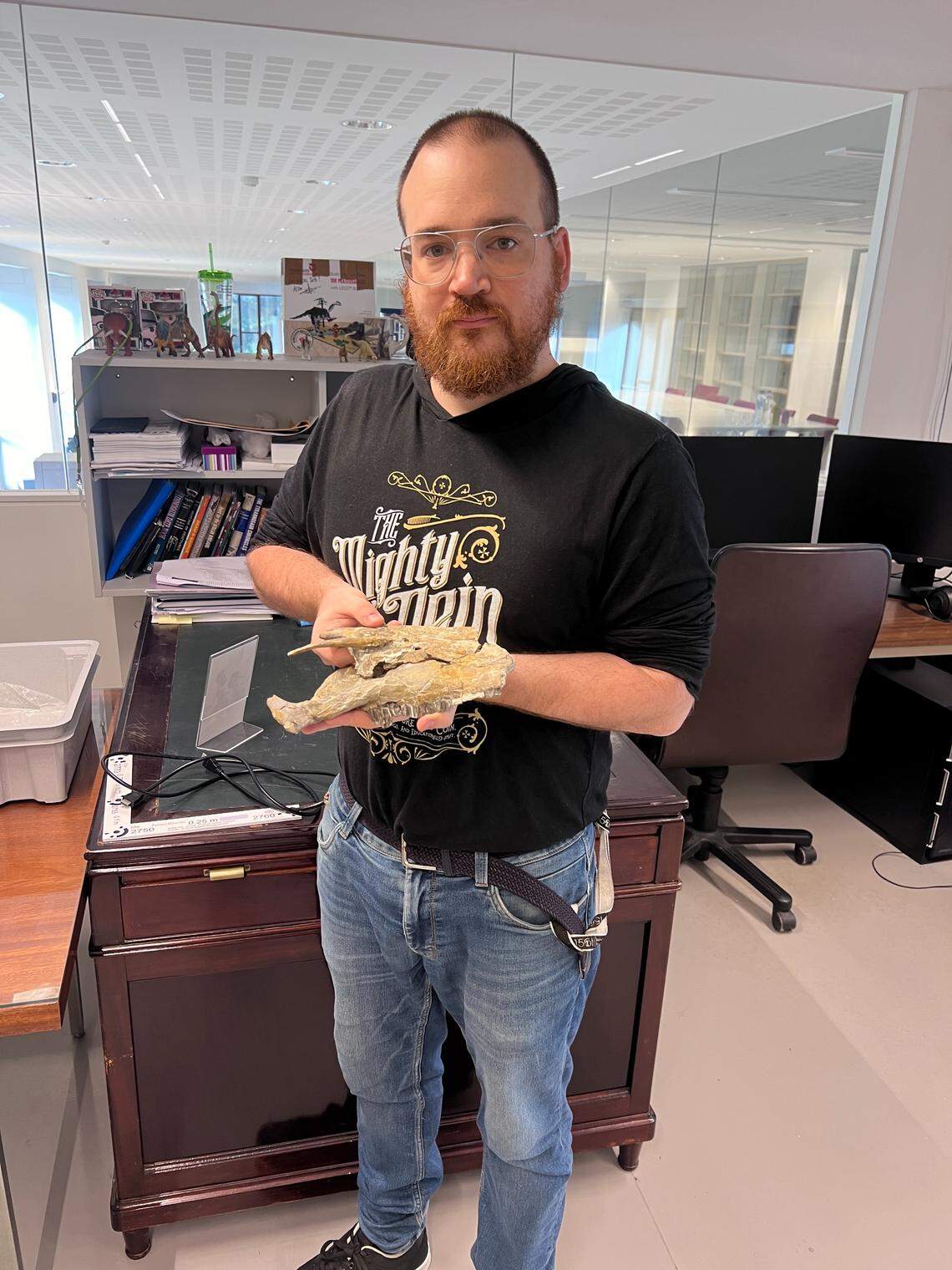 Study author Filippo Bertozzo with the fossil.