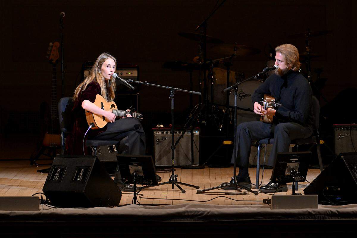 NEW YORK, NEW YORK - MARCH 03: (L-R) Maya Hawke and Christian Lee Hutson perform onstage during the 39th Annual Tibet House US Benefit Concert at Carnegie Hall on March 03, 2026 in New York City. (Photo by Noam Galai/Getty Images for Tibet House US)