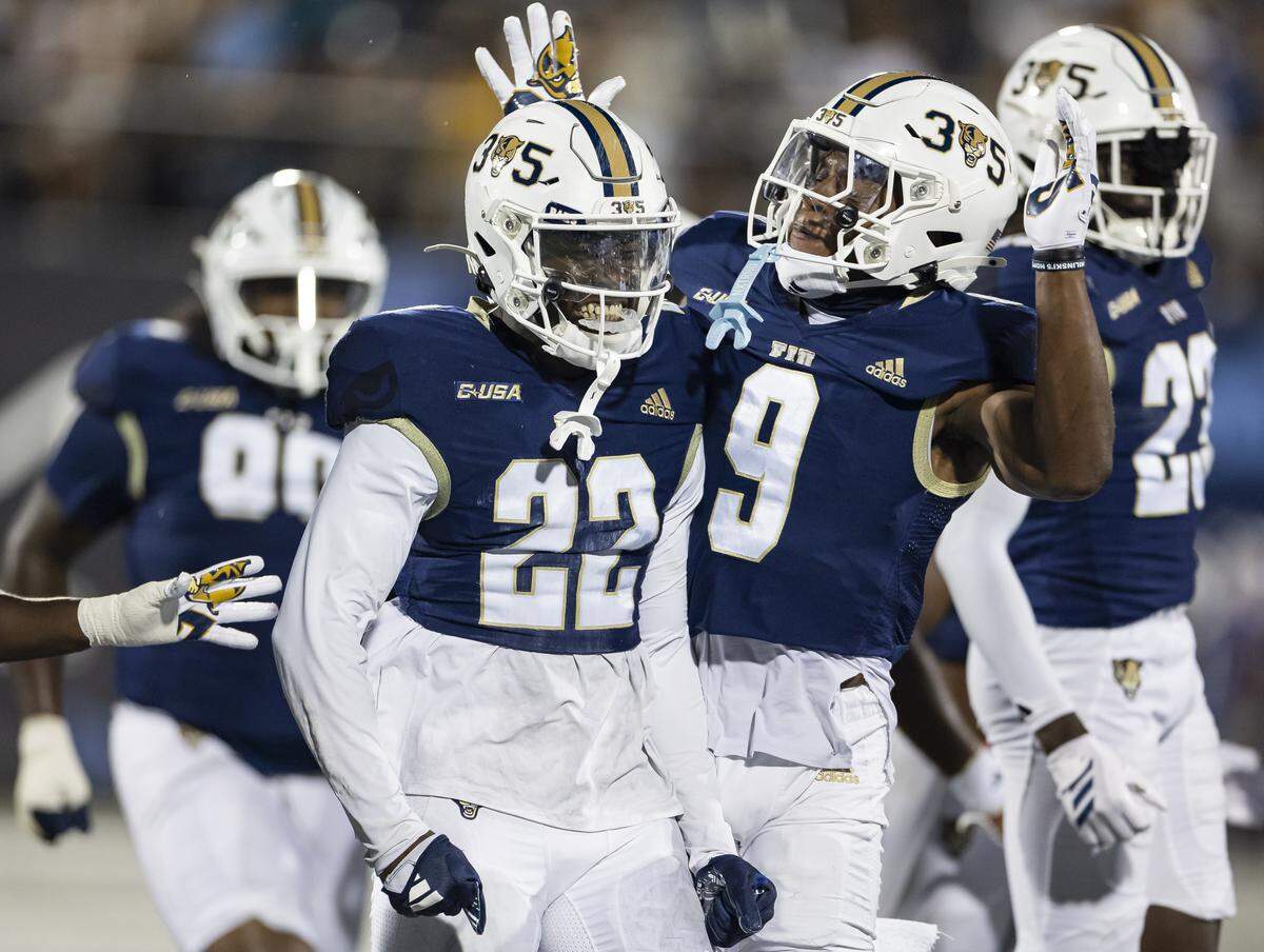 FIU Panthers defensive back Shamir Sterlin (22) celebrates after intercepting the ball against Florida Atlantic University Owls in the first half of their Shula Bowl football game at Pitbull Stadium on Saturday, Sept. 13, 2025, in Miami, Fla.