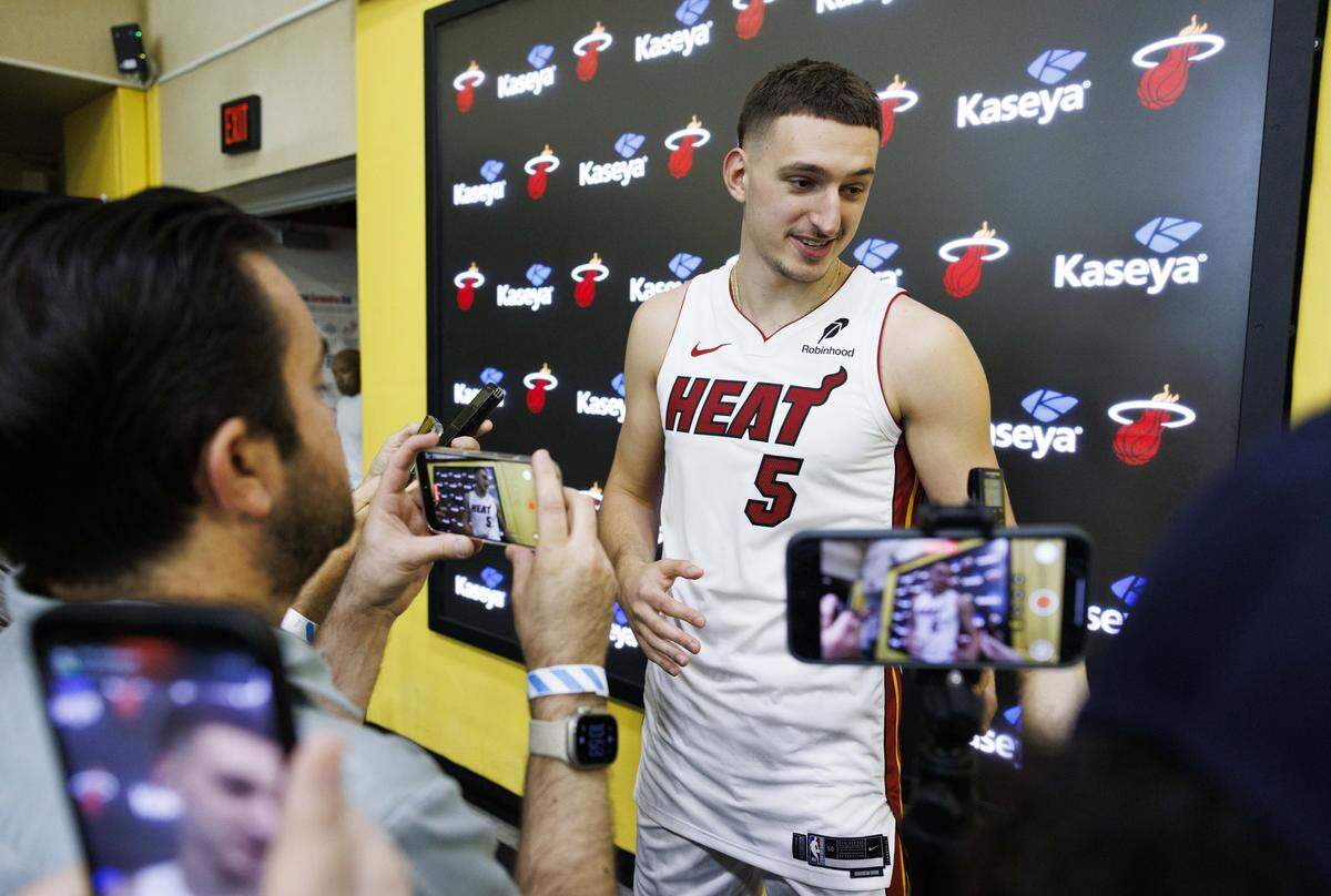 Nikola Jovic (5) talks to reporters during the Miami Heat Media Day on Monday, Sept. 29, 2025, at the Kaseya Center in Miami.