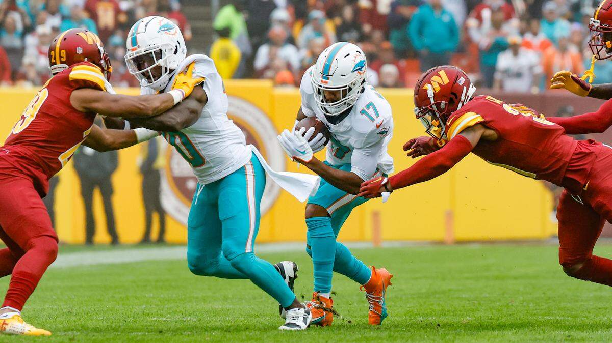 Miami Dolphins wide receiver Tyreek Hill (10) blocks for wide receiver Jaylen Waddle (17) in the first half against the Washington Commanders at FedEx Field in Landover, Maryland on Sunday, December 3, 2023.
