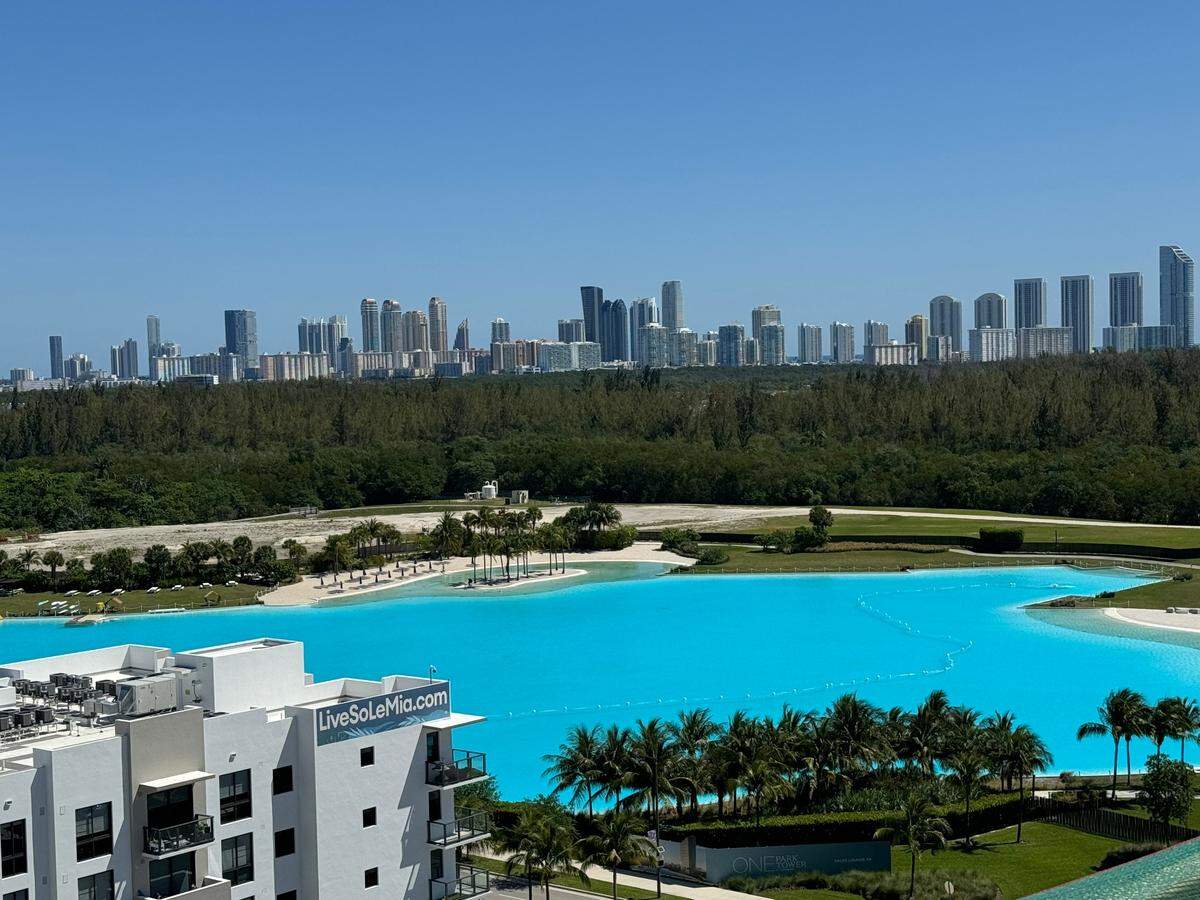 A view of the SoLé Mia’s seven-acre man-made Crystal Lagoon, which has Caribbean-blue water and sandy beach areas, from the roof of UHealth’s new center.