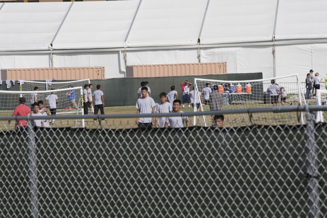 Unaccompanied undocumented children at the Homestead Temporary Shelter for Unaccompanied Children play soccer on Monday, June 18, 2018.