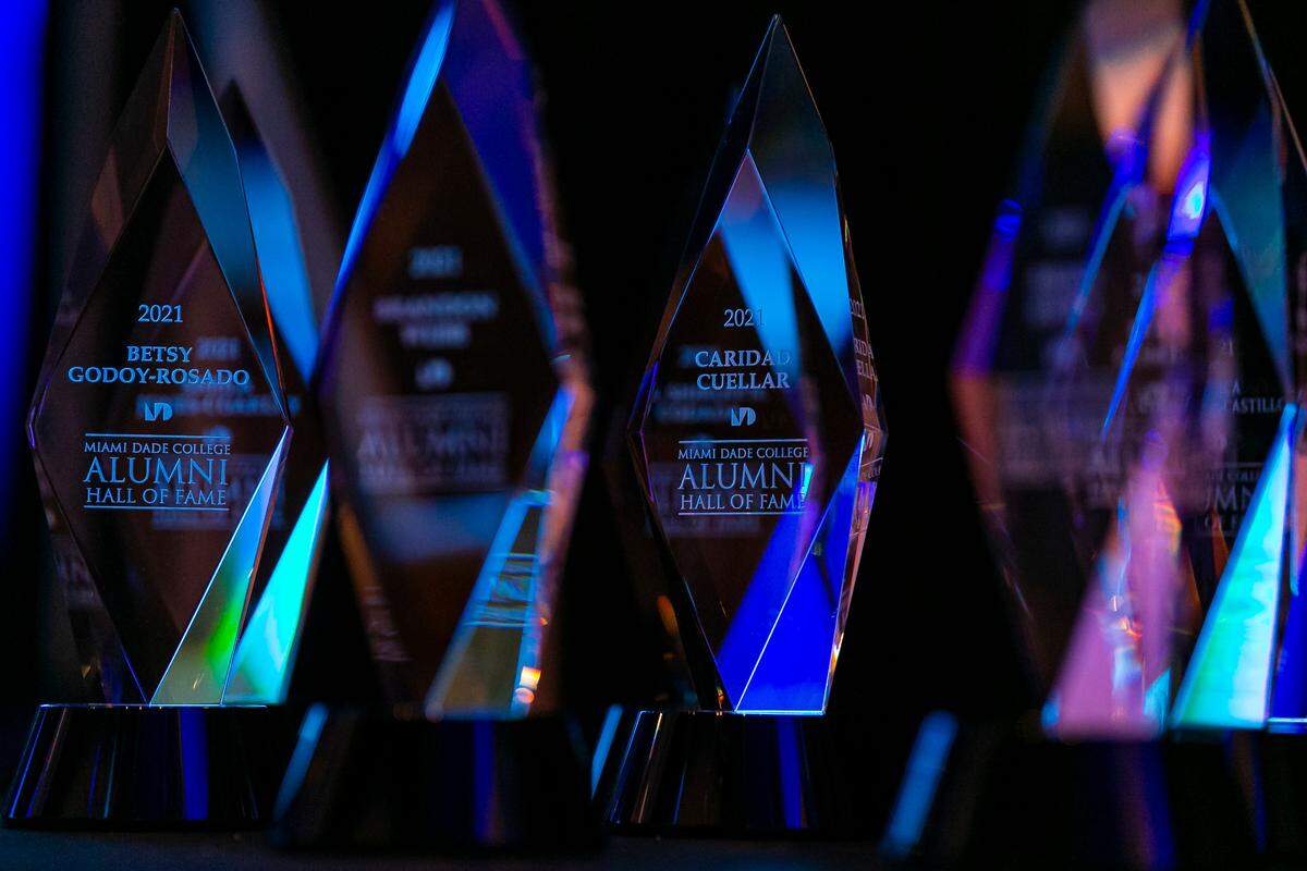 Awards are on display before the start of Miami Dade College’s 2021 Alumni Hall of Fame Ceremony at the school’s Wolfson Campus in downtown Miami on Wednesday, June 9, 2021. MDC recognized ten alumni on the frontlines of the coronavirus pandemic in a special heroes edition of the annual Alumni Hall of Fame induction ceremony.