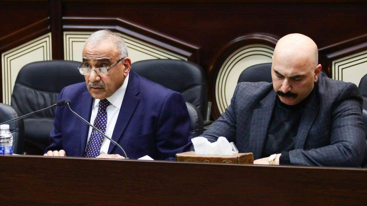 Iraqi Prime Minister Adel Abdul Mahdi, left, attends a parliamentary session regarding the ouster of U.S. troops in Baghdad.