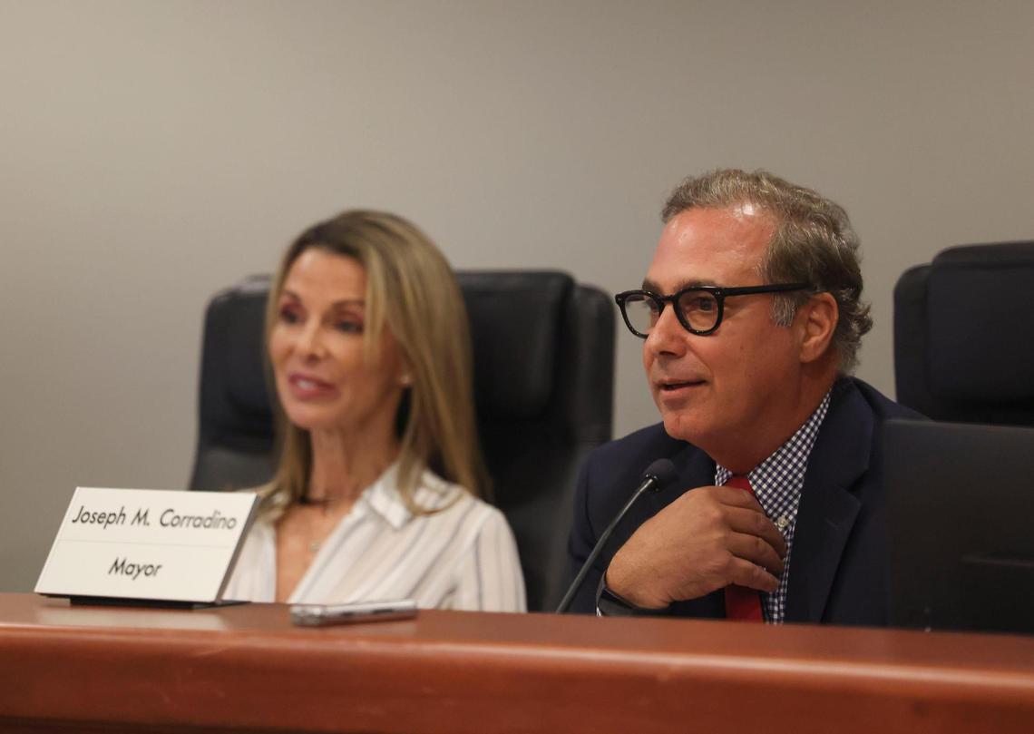 Mayor Joseph Corradino, right, and council member Shannon del Prado listen to community members during a Pinecrest Village Council meeting on Tuesday, Jan. 10, 2023, in Pinecrest.