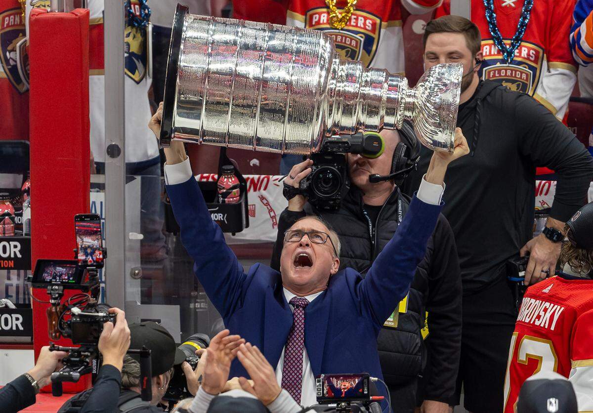 Florida Panthers head coach Paul Maurice lifts the Stanley Cup after the Panthers defeated the Edmonton Oilers in Game 7 of the NHL Stanley Cup Final at the Amerant Bank Arena on Monday, June 24, 2024, in Sunrise, Fla.