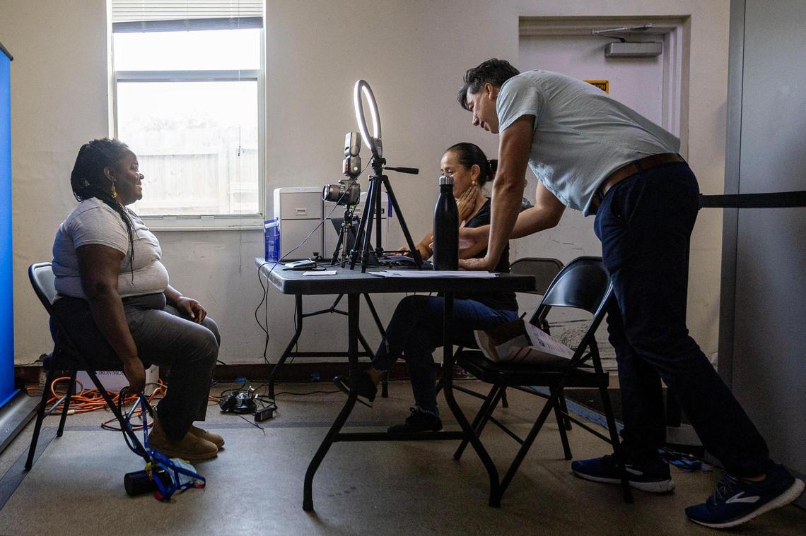 A woman poses for a new Broward County ID card during a community ID event hosted by Legal Aid Service of Broward County in partnership with Salvation Army in Fort Lauderdale, Florida, on Friday, August 18, 2023.