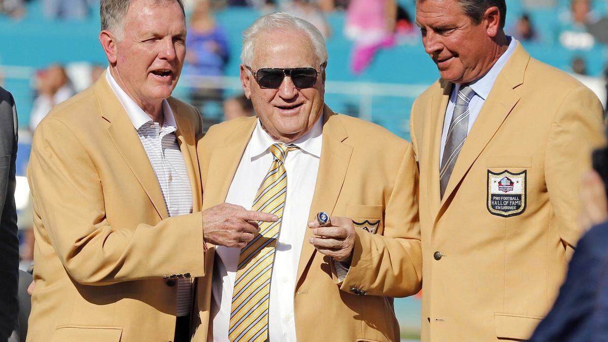 Hall of Fame coach Don Shula is presented with a new Hall of Fame ring at half time. Shula is flanked by fellow Dolphin Hall of Famers Bob Griese, left, and Dan Marino, right, as the Miami Dolphins host the Dallas Cowboys at Sun Life Stadium on Sunday, November 22, 2015