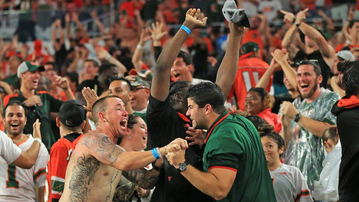 Miami Hurricanes fans react after Michael Badgley kicks the winning field goal in the fourth quarter against Georgia Tech at Hard Rock Stadium on Saturday, October 14, 2017.