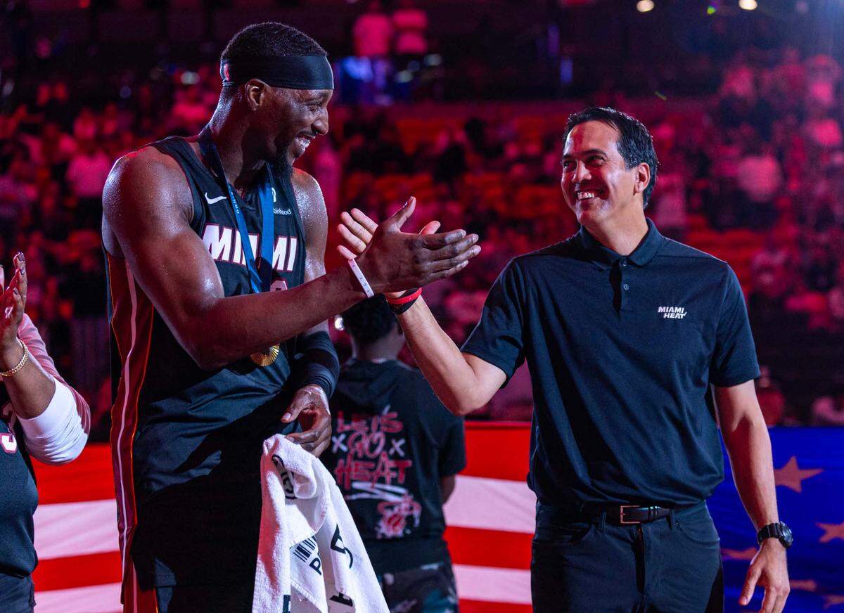 Miami Heat center Bam Adebayo (13) and head coach Erik Spoelstra react during a half-time ceremony to honor the USA gold medalists at Kaseya Center on November 4, 2024, in Miami.