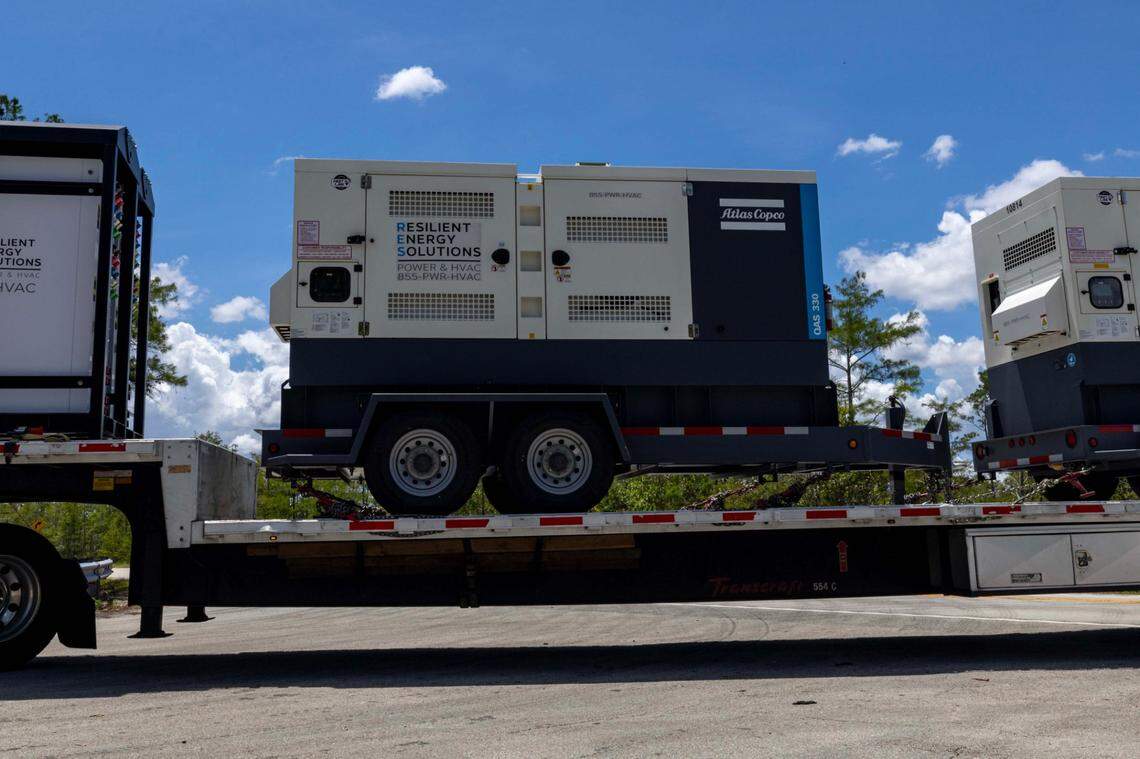 Large generators are driven into “Alligator Alcatraz” during its construction.