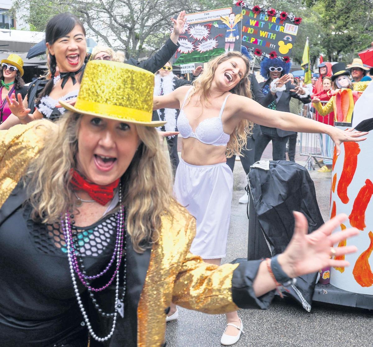 Performers and dancers of the Ronnie (Ron DeSantis) Horror Picture Show sing and dance on the parade route. It was singing, dancing, and parading in the rain as Coconut Grove held its annual satirical parade on Sunday, January 7, 2023 in Miami, Florida.