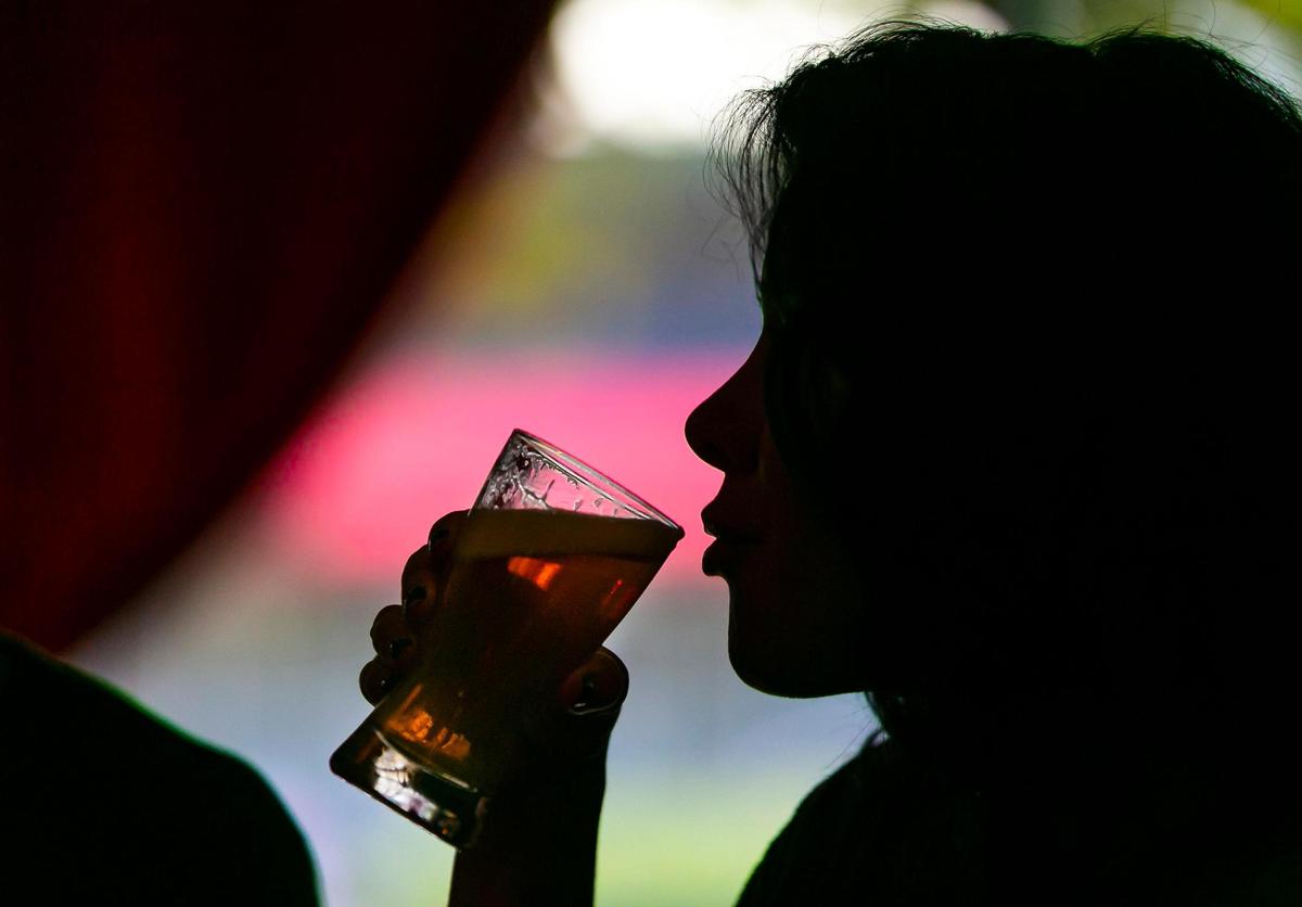 Debbie Vega drinks a beer at The Mighty.