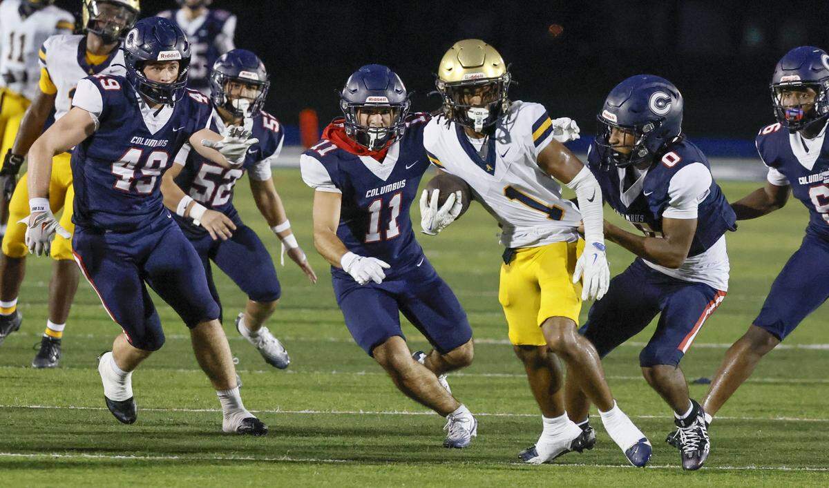 Columbus Explorers linebacker Walter Hall (0) takes down St. Thomas Aquinas Jermiyah Douglas (1) on a punt return in the first half at Tropical Park Stadium in Miami, Florida, on Friday, September 5, 2025.