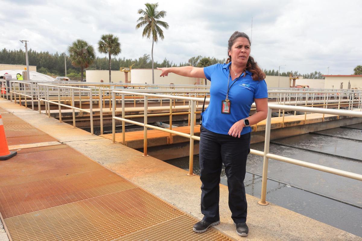 Chief Plant Operator Sandra Hernandez signals from the settling tanks during a tour of the Central District Wastewater Treatment Plant in Virginia Key, Florida, on Thursday, Jan. 16, 2025.
